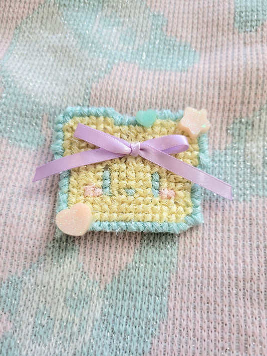 Yellow crossstitch purple bow bear 2way clip